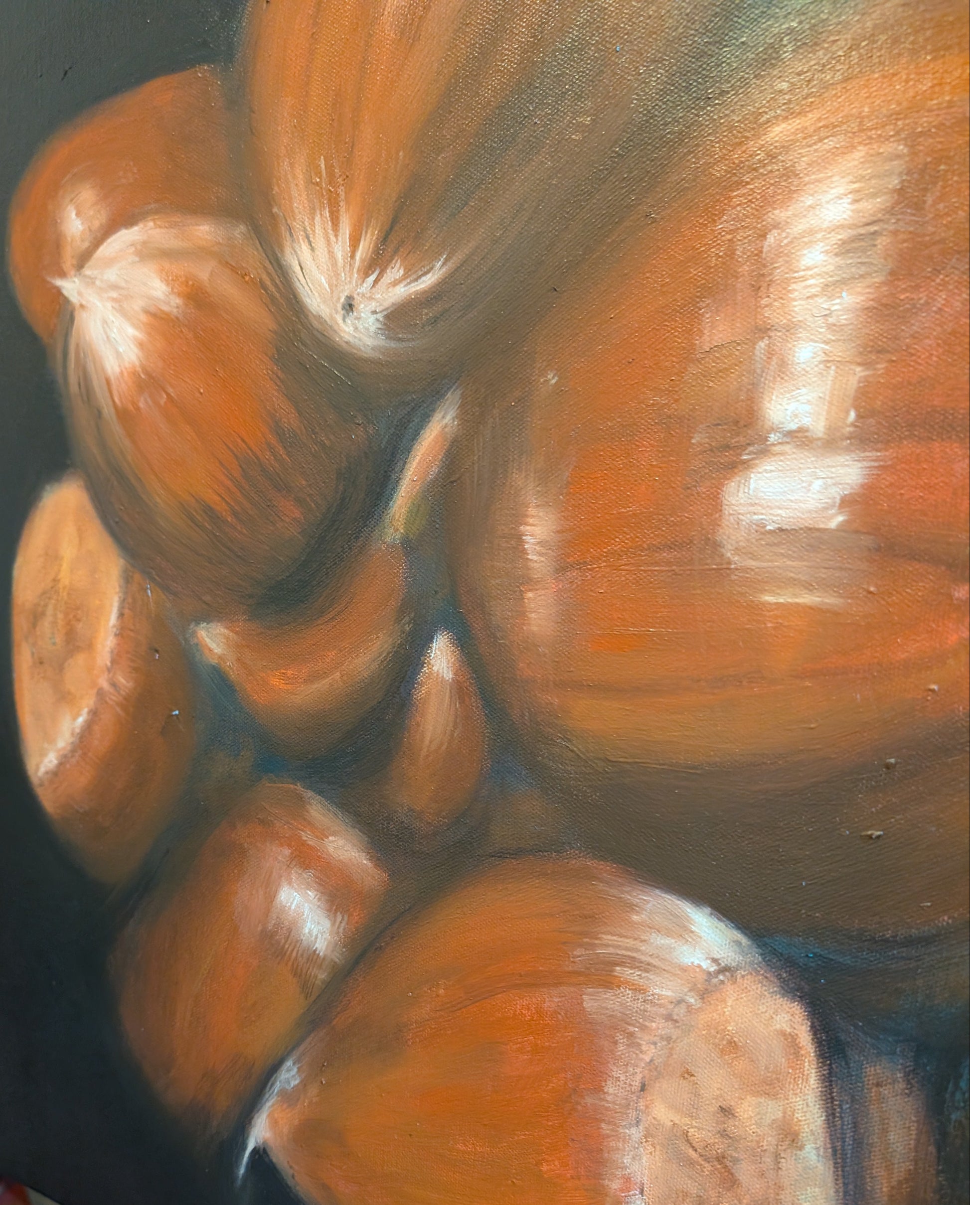 Detail of a painting of chestnuts on a dark background